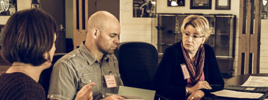 CSTI Course - Students sitting at table having a discussion.